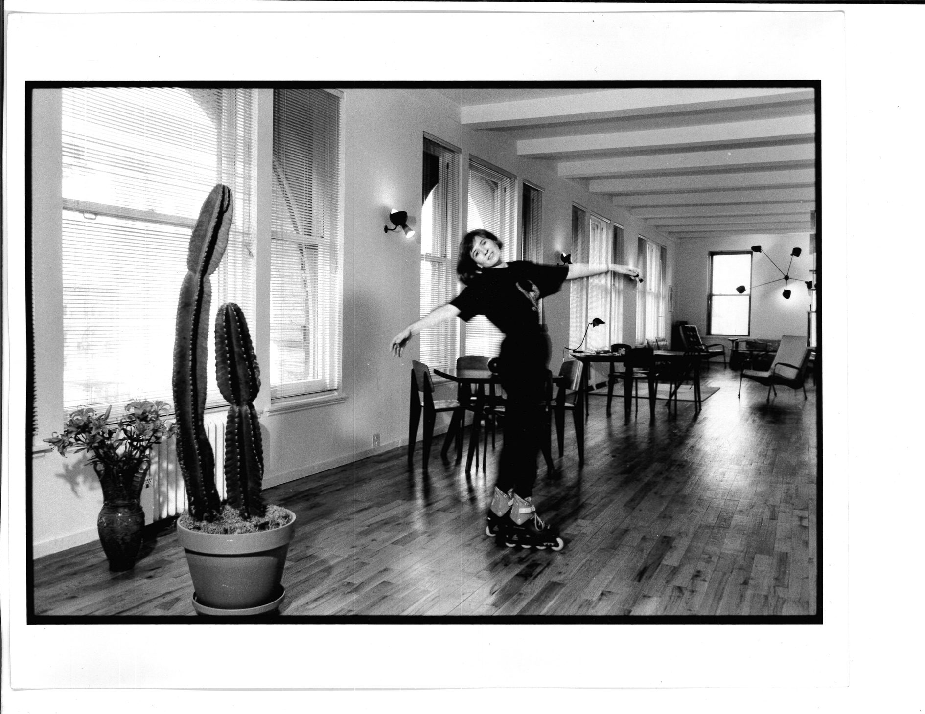 Nicole Miller rollerblading through her loft studio